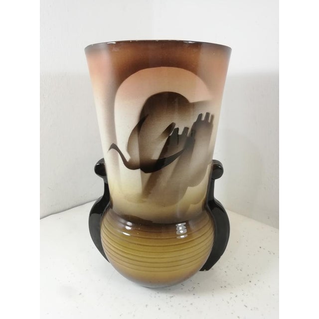 Beautiful and rare vase produced in the city of Civita Castellana. Art Deco vase with airbrush coloring. An object that...