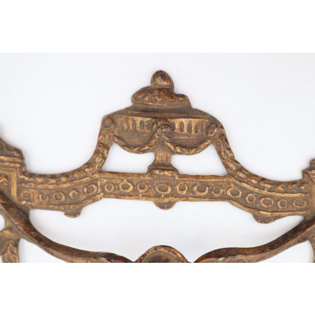 Antique Empire style drawer pull made of brass with intricate details. The original mounting screws are not available....
