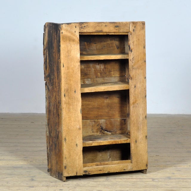 Primitive cabinet from Transylvania, made of sawn or carved beechwood, circa 1850. Three interior shelves. This cabinet...