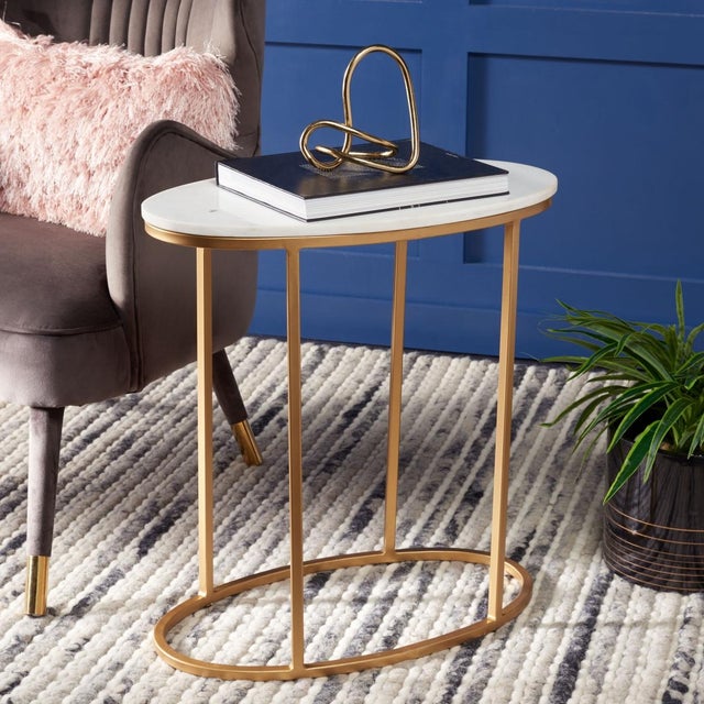 Elevate your living space with the Tage marble side table. This piece features a sleek white marble top that beautifully...