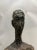 Monumental Patinated Fiberglass Figure in the Style of Alberto Giacometti A monumental fiberglass sculpture with a bronze...