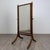 An exceptionally well-crafted early 20th-century English Edwardian cheval mirror, finely constructed in richly figured...