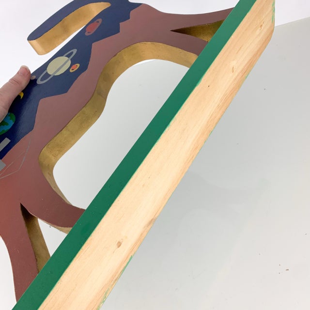 Incredible one of a kind hand made wooden wolf with hand painted double sided scenes. One scene depicts outer space with...