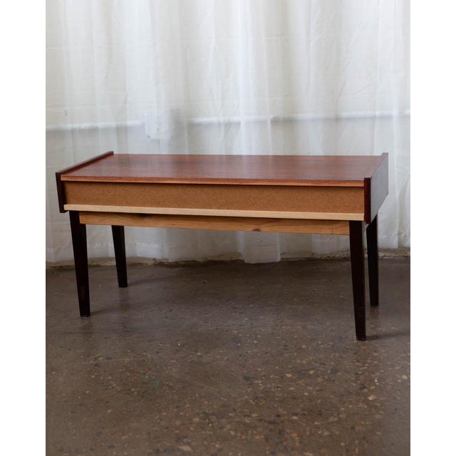 A refined Danish rosewood side table by Pedersen & Hansen, produced in the 1970s. The richly grained rosewood, low...
