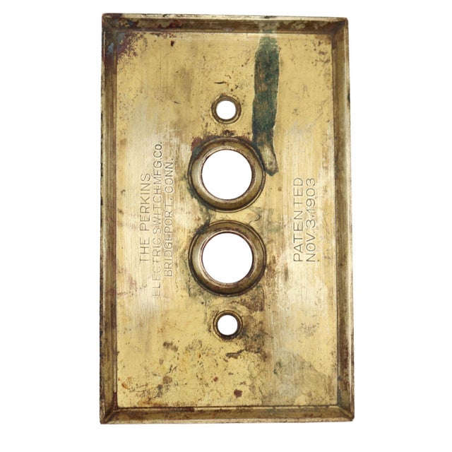 Single gang two push button switch cover made of brass with a polished brass finish. Made by The Perkins Electric Switch...