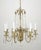 French style chandelier with a brass frame draped in faceted crystal ball swags and spears. The chain is made of steel....