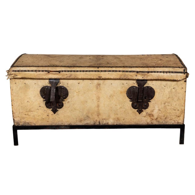 Leather trunk with double front clasp. Nail head details. Original metal hardware. Separate metal stand.