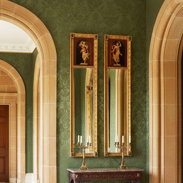 PAIR OF REGENCY PARCEL-GILT PIER MIRRORS WITH GRISAILLE PAINTED PANELS England, circa 1810-30 74 7/8" H x 15 7/8" W x 1...