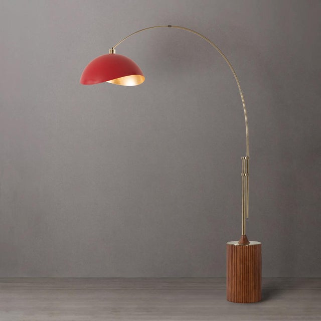 Built with a weathered brass steel body and a dark walnut wood base, the Tambo Arc Lamp is a Mid-Century Modern...