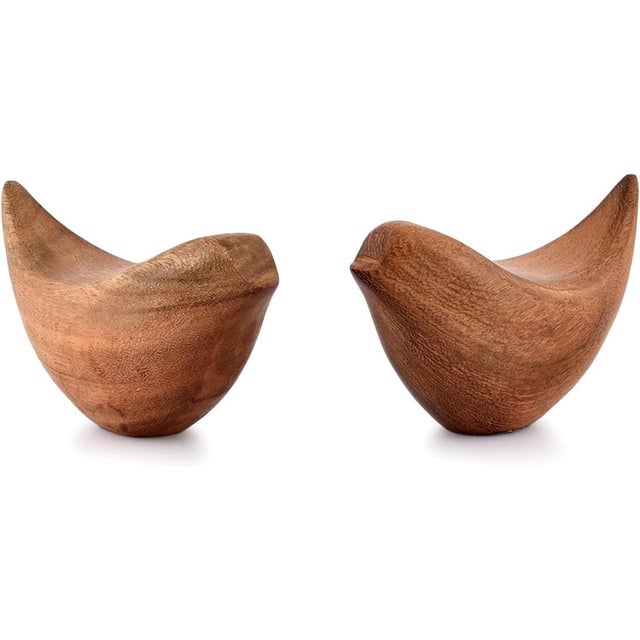 This modern pair of golden bird sculptures brings warmth and elegance to any space. Handcrafted from durable acacia wood,...