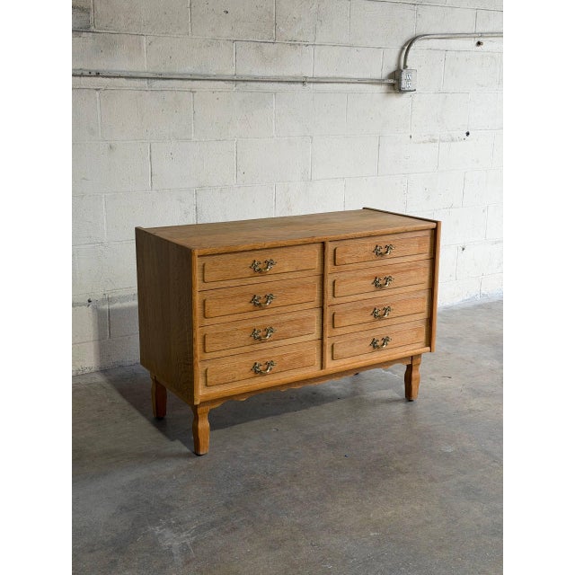 This vintage wooden dresser features a clean-lined rectangular profile paired with eight drawers for ample bedroom...