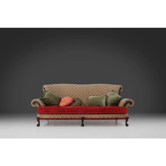 This large Victorian sofa that dates back to 1890 has a comfortable and deep seat, allowing you to relax. The seat is made...