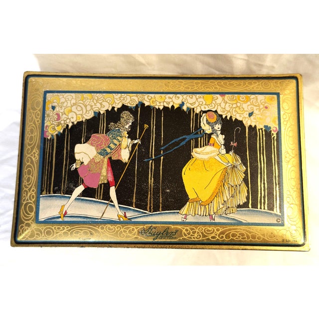 Step back into the Roaring Twenties with this stunning Art Deco candy tin from Huyler’s of New York. This 2lb...