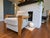 Beautiful vintage Thayer Coggin armchair with substantial solid wood arms/frame and neutral textured upholstery. Likely...