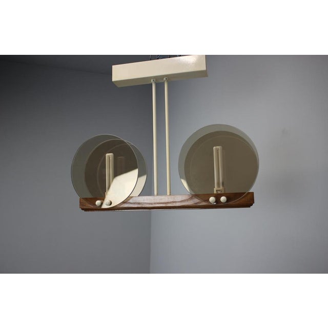 Made in Czechoslovakia Made of Glass,Wood, metal US wiring compatible Fully Functional Good Original condition. Up to 250V...