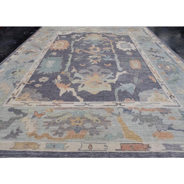 12'2" x 15'5" Made from 100% high-quality wool, this Pile-Knotted rug is dyed with natural vegetable colors. It reflects...