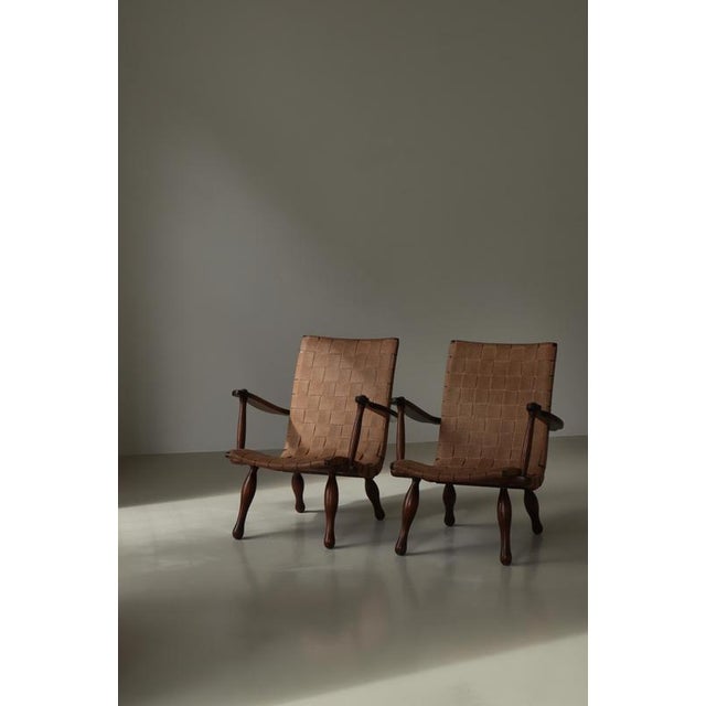 An amazing and rare pair of original lounge chairs made in Sweden in the 1940s in the typical Swedish "sportstuga"...