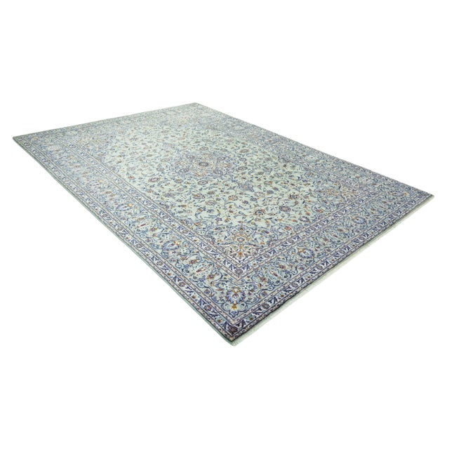 This magnificent hand-knotted Kashan oriental rug, measuring an exceptionally generous 425 x 303 cm, is a true masterpiece...