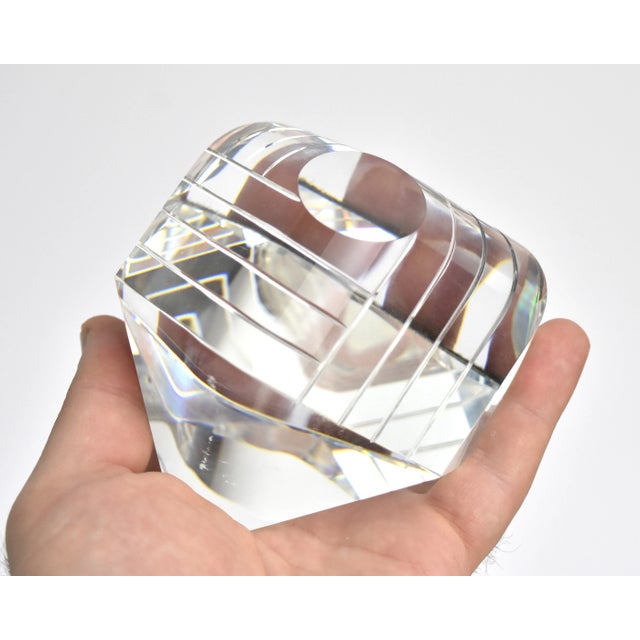Fabulous crystal glass paperweight. Featuring concentric channeled waves around a raised small circle, with widely curved...