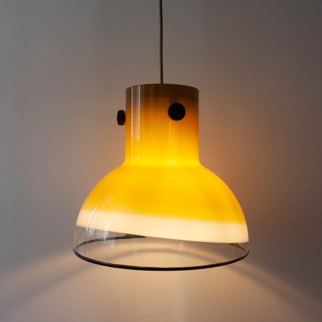 This pendant lamp was designed and produced by Peill & Putzler, in Germany, during the 1970's. It is a piece made entirely...