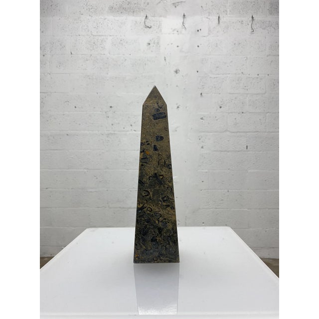 Single mable obelisk from the 1970s.