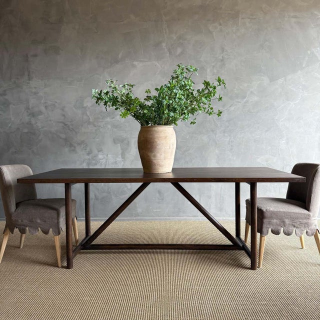 Introducing the modern Oak Dining Table, designed with clean lines and a stunning wire brush finish for a contemporary...