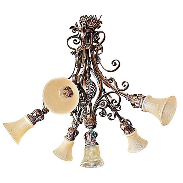Truly unique, a wrought steel French chandelier finished in bronze-brown, circa 1900-1920 with Art Nouveau influences,...