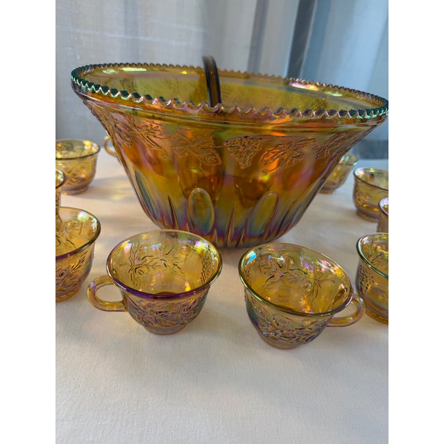 Beautifully elegant iridescent Gold Carnival Glass punch Bowl with 12 Glasses and plastic ladle. Pouch Bowls make great...
