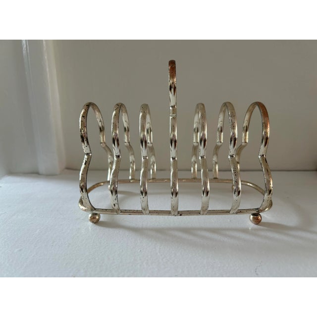 Mid 20th century Silverplate toast caddy or perfect letter holder for desk.6 slots. Ball feet.