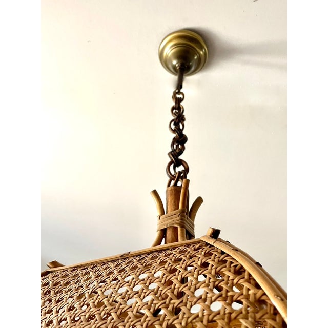 Square openwork pendant light from the 1970s, composed of a bamboo frame and cane leaves and suspended by rattan rings...