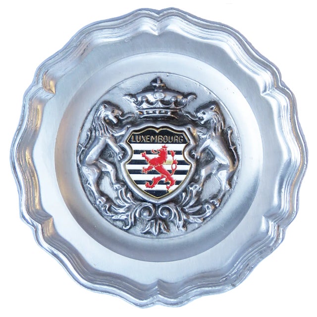 Handsome European silver toned souvenir plaque and ashtray. The porcelain ashtray (4"W x 4"D) exhibits a strong Art Deco...