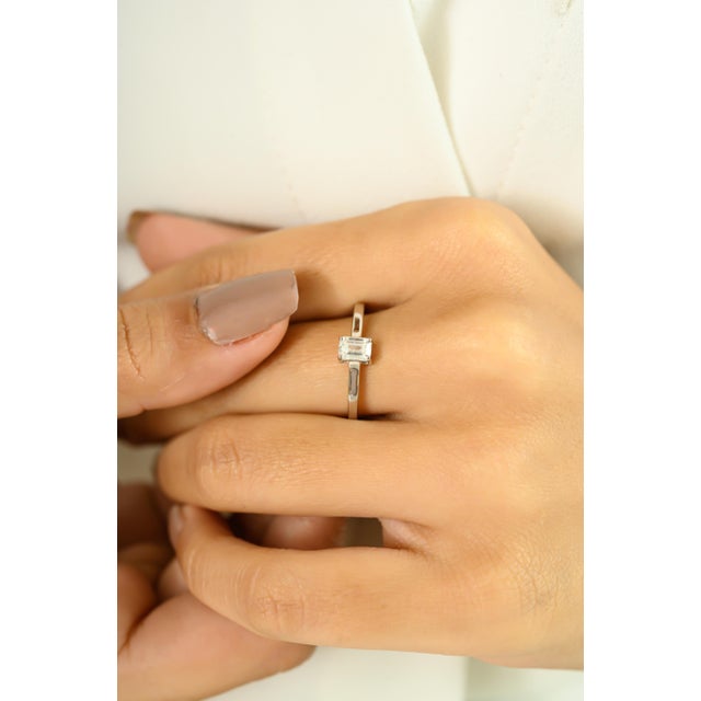 Refined and minimalist, this elegant ring is crafted in lustrous 18K white gold and features a stunning 0.41-carat...