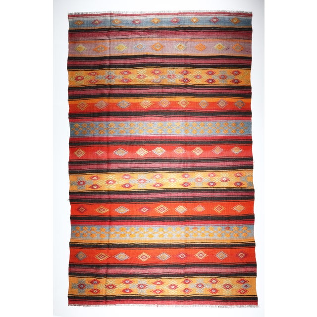 Color: Orange, Brown, Red, Yellow, Light Blue. This is a one of kind old Nomadic Handwoven village kilim, it is coming...