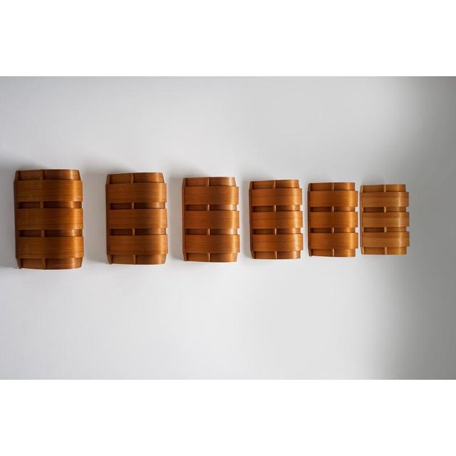 A refined set of swedish wall lights model v155, designed by hans-agne jakobsson and produced by ab ellysett markaryd. The...