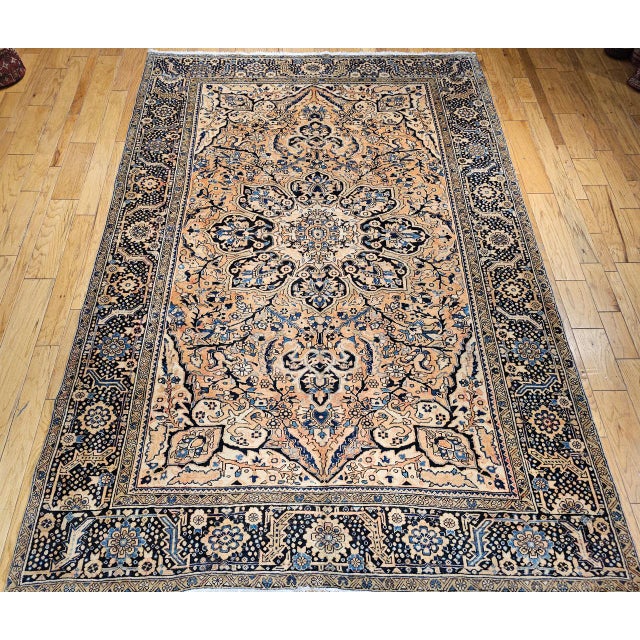 "An exceptional antique Heriz rug, masterfully hand-knotted and celebrated for its bold geometric composition and enduring...