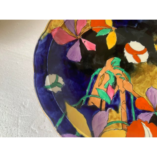 Designed by Molly Hancock multicolored floral and abstract designs on cobalt blue