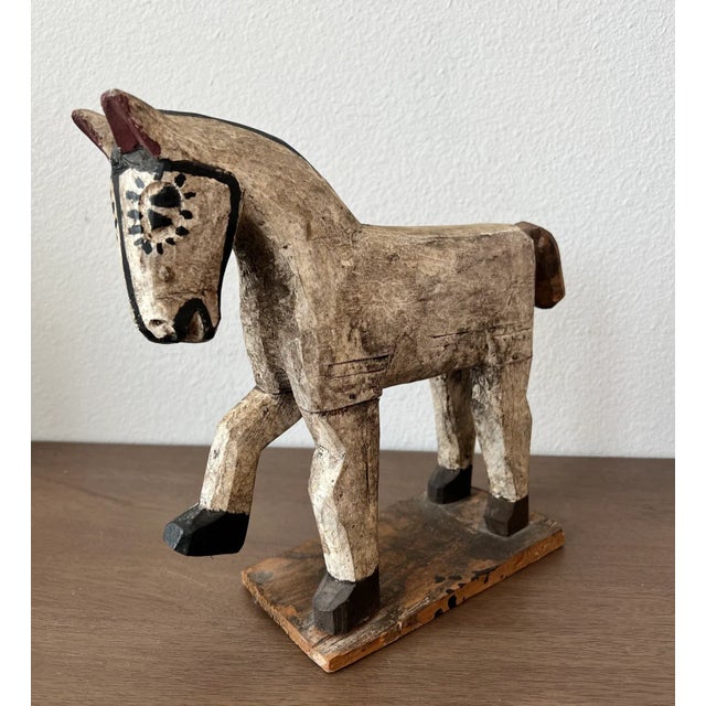 A most charming hand carved and painted wooden horse folk art sculpture with beautifully aged original patina, dating to...