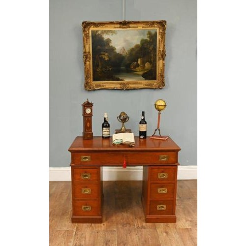 A handsome late 19th century Campaign pedestal desk in richly figured mahogany, offering both practicality and understated...
