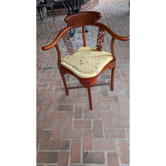 This is a vintage, hand-carved solid rosewood corner chair. It comes with a custom-made pure silk, reversible yellow seat...