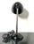 An icon of modernist design, this table lamp designed by Eric Kirkman Cole combines the elegance of black Bakelite with...