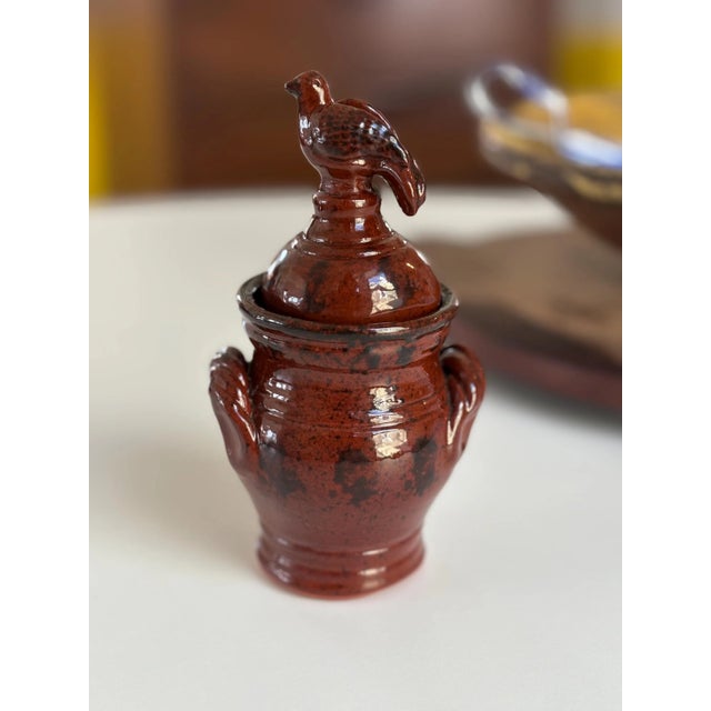 This is a rare piece by Ned Foltz, 2000. This is a small jar, standing about 6” tall to the top of the bird finial. The...