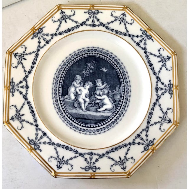 Charming set of 19th century Wedgwood octagon plates patterned with central medallion of putties at play and floral...