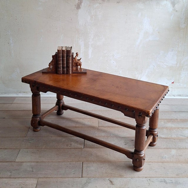 This 50's Spanish coffee table can also be used as a bench. Sturdy.