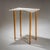 Pair of wall consoles on tall tapered legs with X-shaped copper stretcher. The highlight is the stepped white marble tops...
