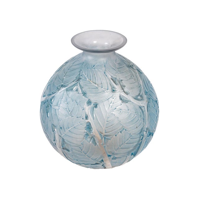 Lalique "Milan" vase in clear glass, blue patina with leaf decoration. Dimensions: 28 x 25cm. Produced before 1950 and...