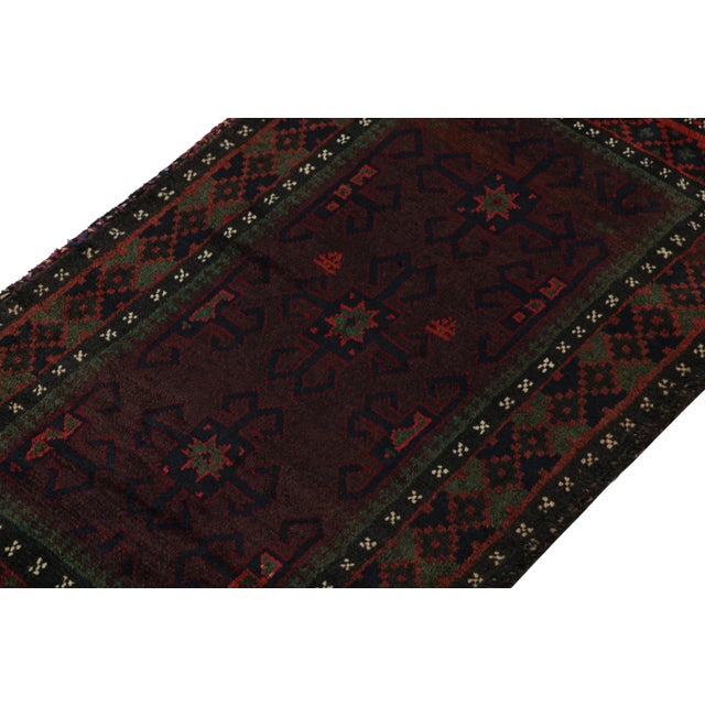 Hand knotted in wool, this 2x4 Baluch rug represents a new line of tribal carpets in the Modern Classics Collection by Rug...
