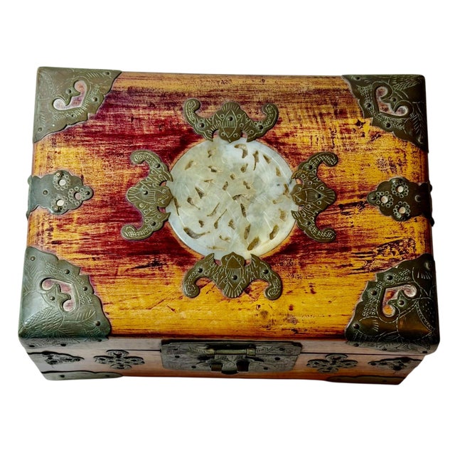 A charming Chinese strongbox dating to the 1920s, crafted from rich rosewood and accented with brass straps. The top...