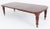 A fine Victorian mahogany extending dining table of impressive scale and elegant proportions The table is raised upon...