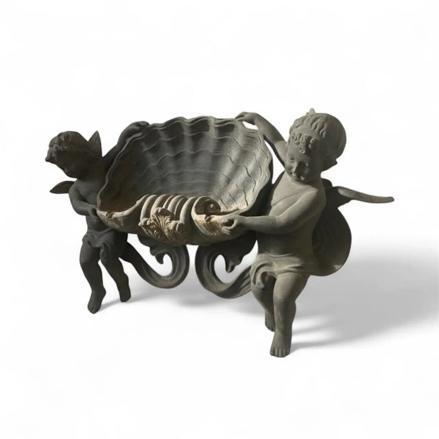 This is an exquisite Italian wall fountain, beautifully crafted in patinated bronze. While its design is rooted in the...