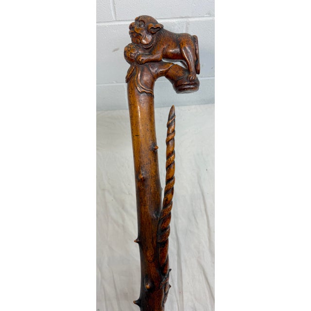 This large antique 19th century Chinese hand carved wooden walking stick is a unique and high quality sculpture. Sculpted...